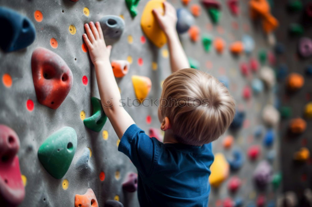 Similar – Image, Stock Photo little boy climbing a rock wall indoor