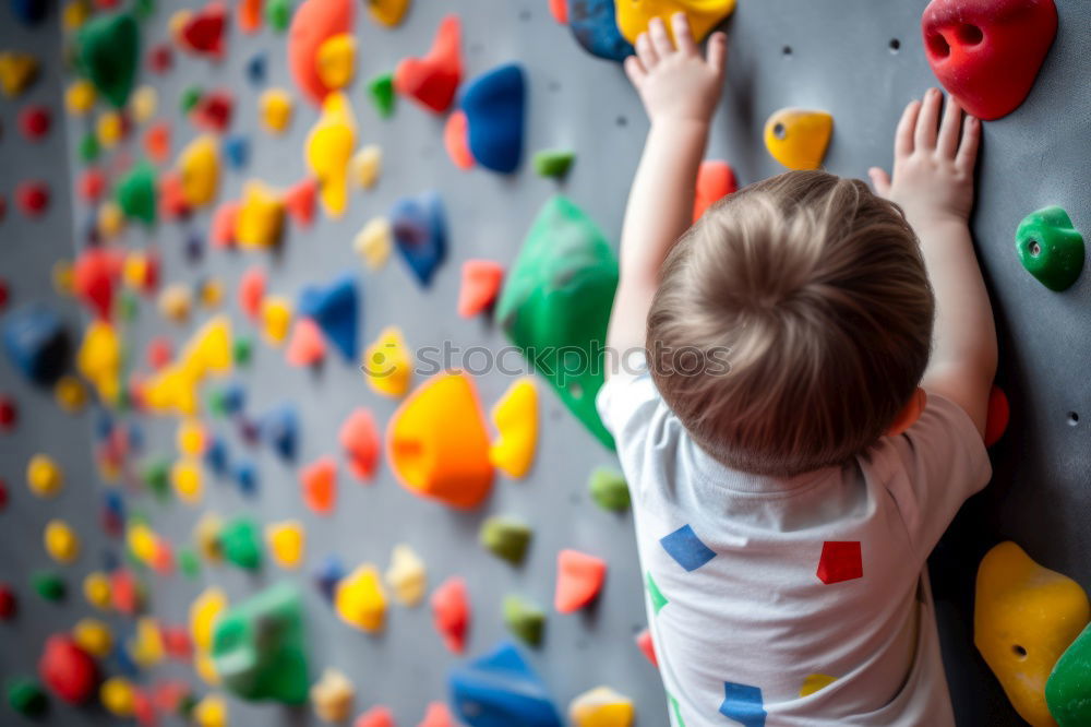 Similar – Image, Stock Photo little boy climbing a rock wall indoor