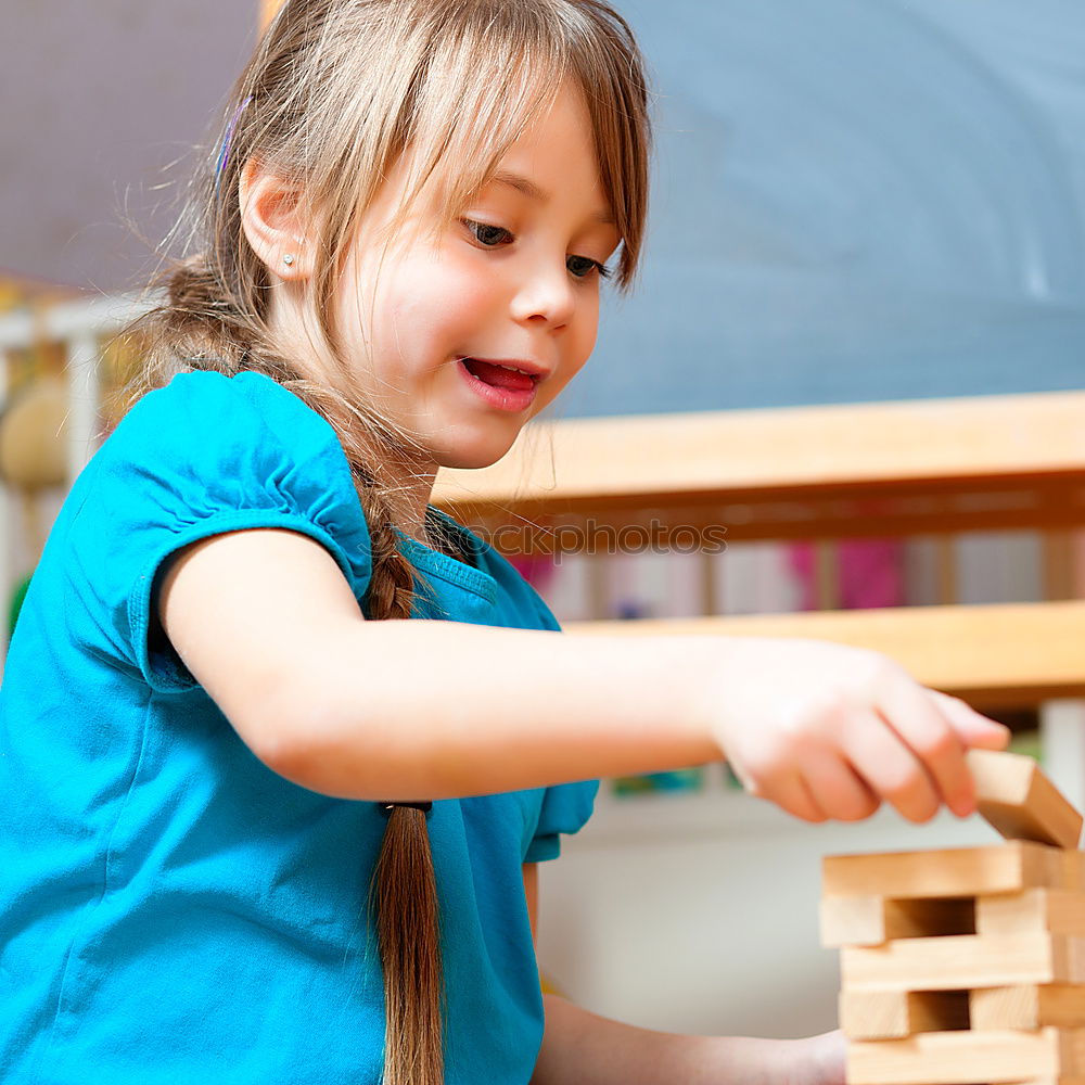 Similar – Image, Stock Photo Happy baby playing with toy blocks.