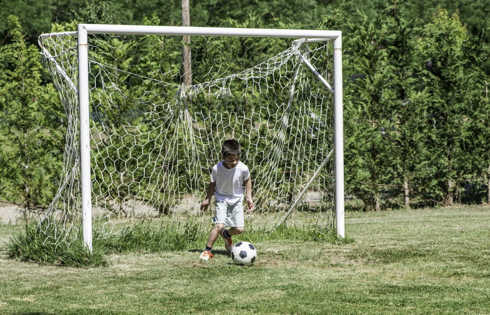 Similar – Boy playing football