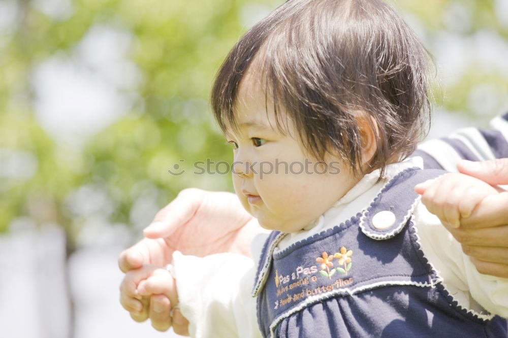 Similar – Image, Stock Photo Beautiful baby playing with her toys at carriage in a walk at park