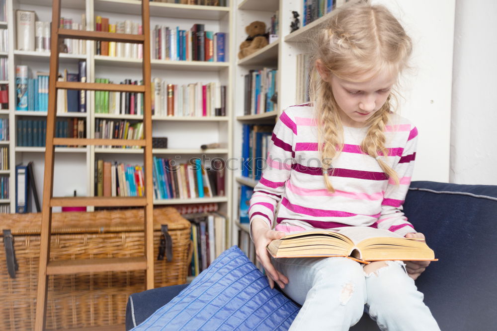 Similar – Image, Stock Photo Girl disguised as a butterfly reading with her doll