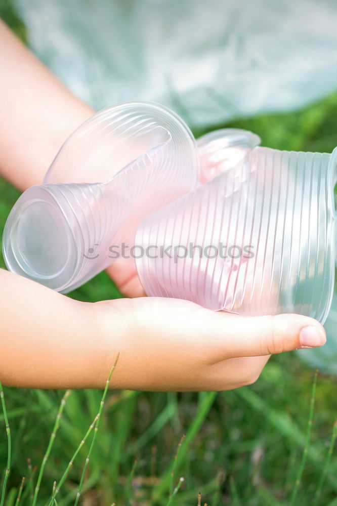 Similar – Image, Stock Photo Hand hold very small cup of coffee.
