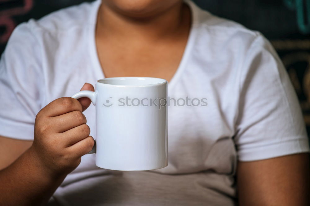 Similar – Ethnic woman stirring cup of coffee