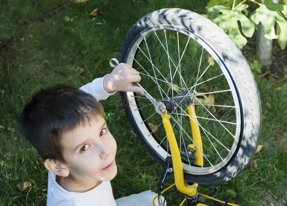 Similar – father and daughter fixing problems with bicycle outdoor