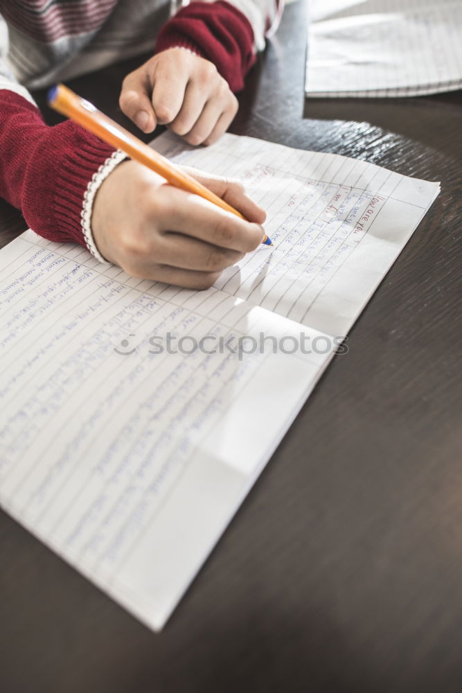 Child write in a notebook