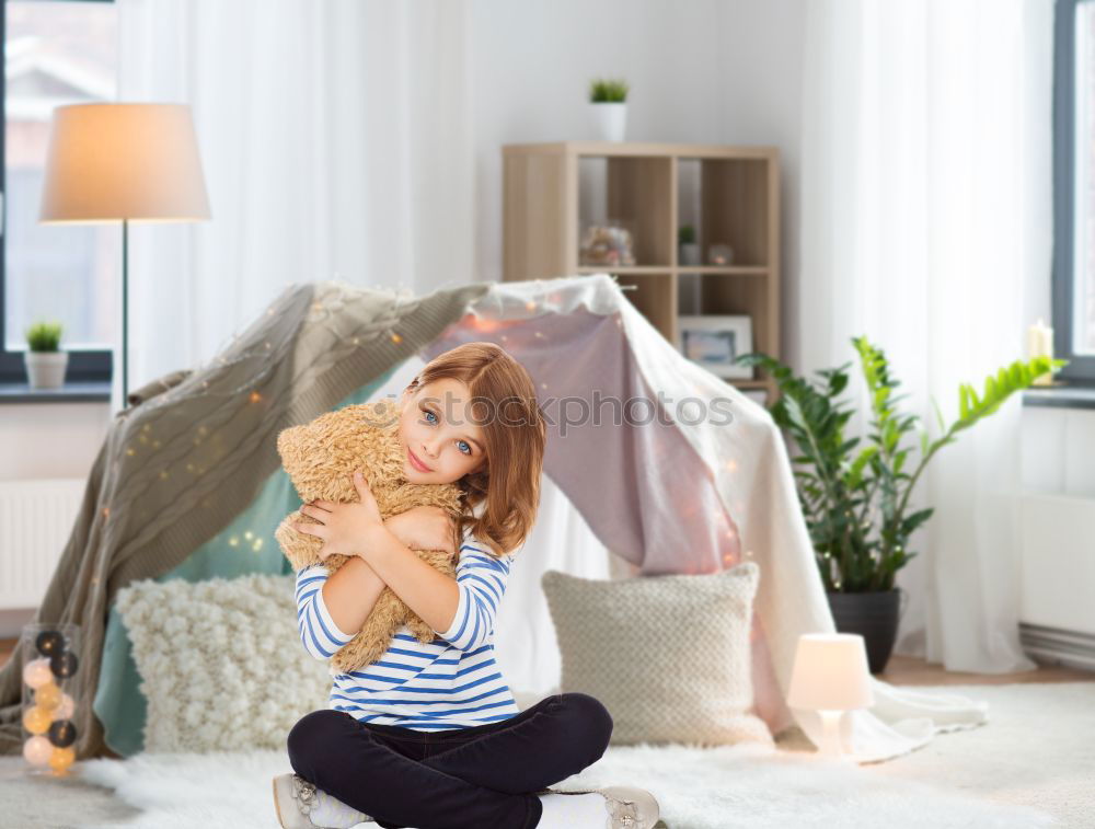 Similar – Image, Stock Photo African girl sits next to her teddy bear at home