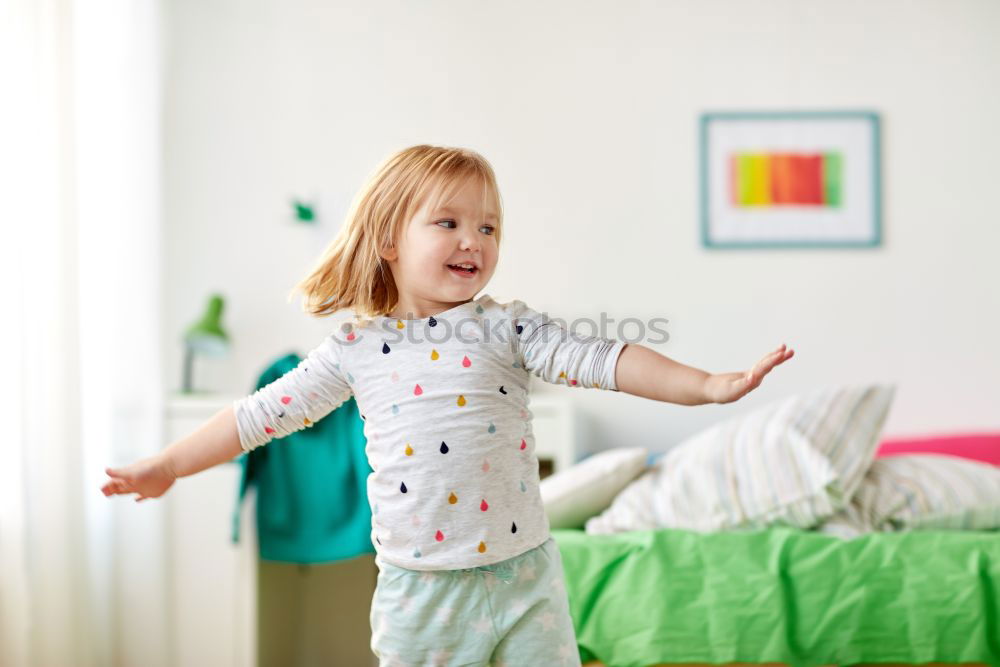 Similar – beautiful kid girl jumping on bed