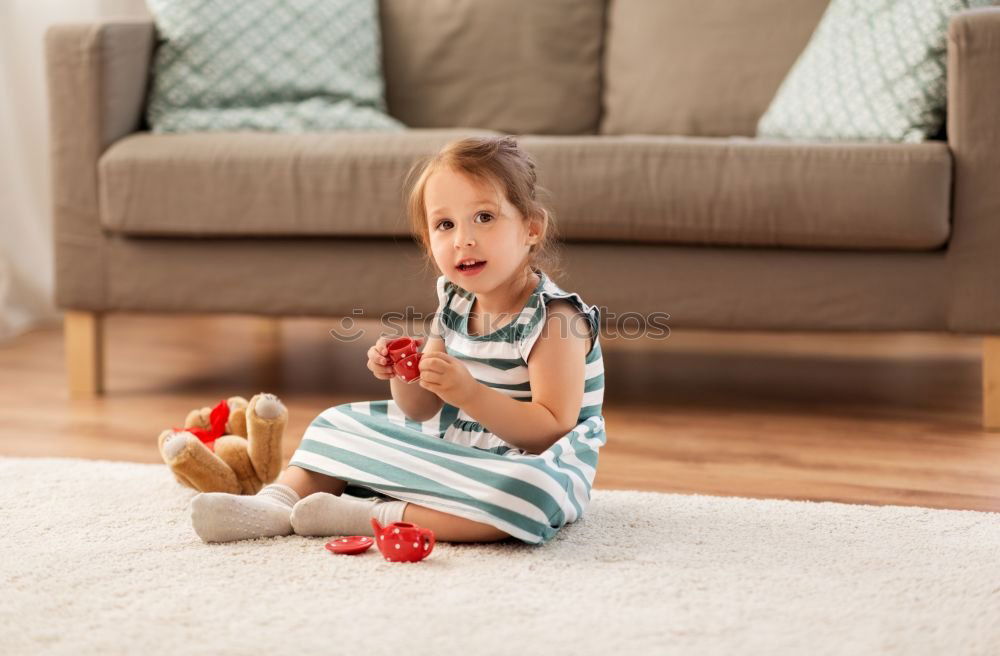 Similar – cute toddler girl put on socks at home