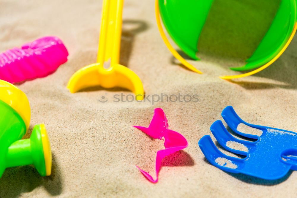 Similar – Image, Stock Photo Colourful toys in the sand