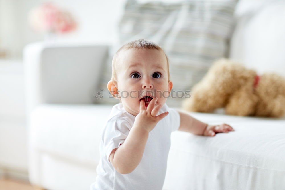 Similar – Baby in a bed in frame of heart shape. Out of focus baby