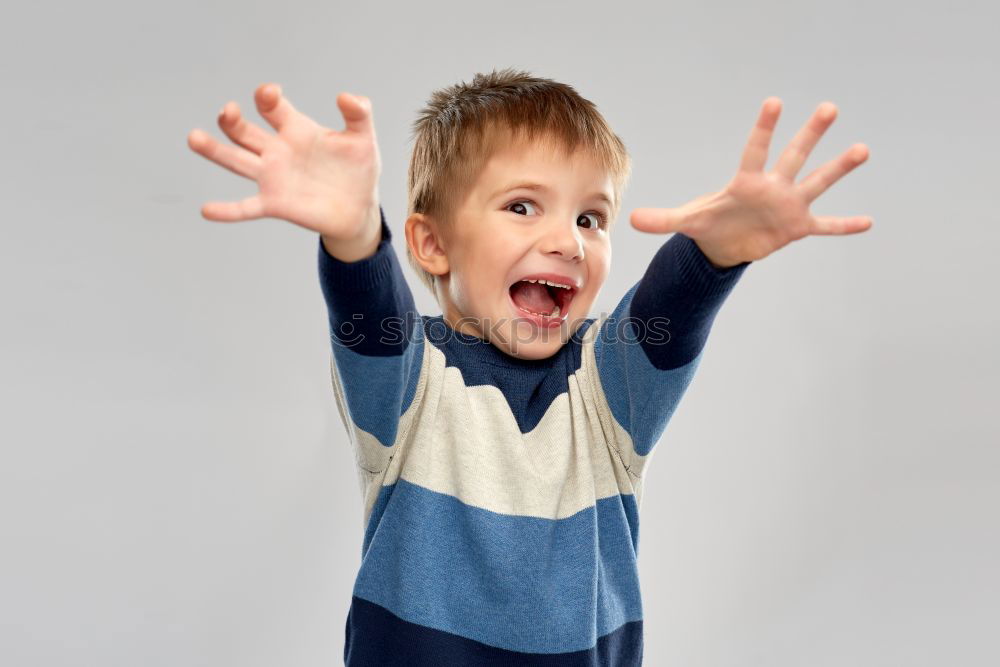 Similar – Girl with dirty hands showing tongue in room