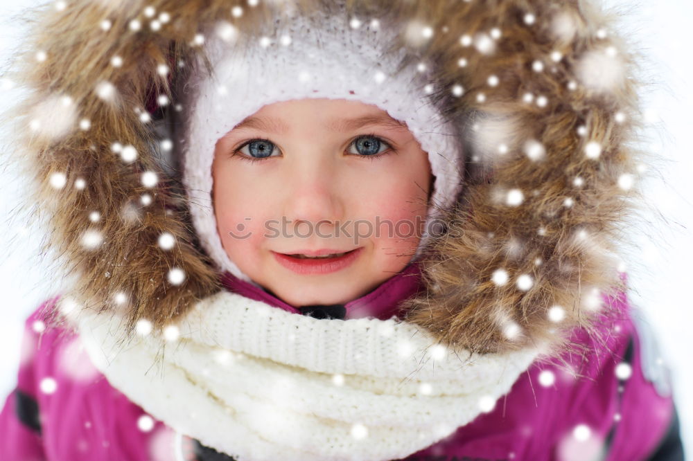 Similar – Little boy having fun playing with fresh snow during snowfall. Baby catching snowflakes on gloves. Kid dressed in warm clothes, hat, hand gloves and scarf. Active winter outdoors leisure for child