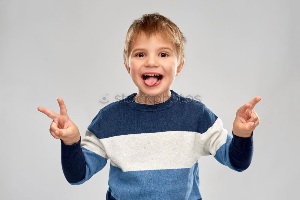 Similar – Image, Stock Photo Rude boy sticking out his tongue