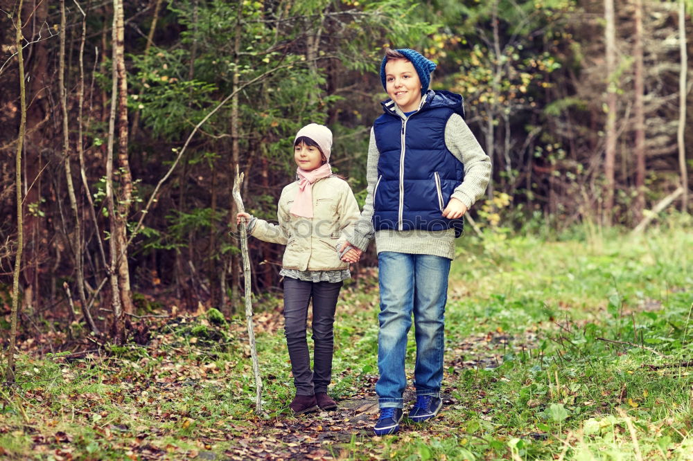 Similar – Happy family walking together holding hands in the forest