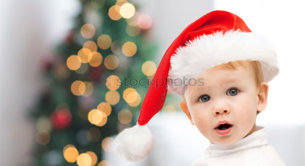 Similar – Image, Stock Photo Young girl decorating Christmas tree with lights at home