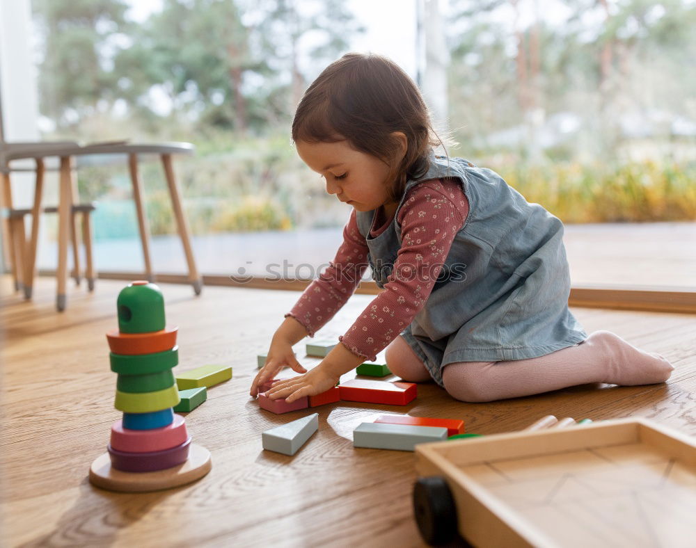 Similar – Image, Stock Photo Woman assembling furniture at home with Daughter