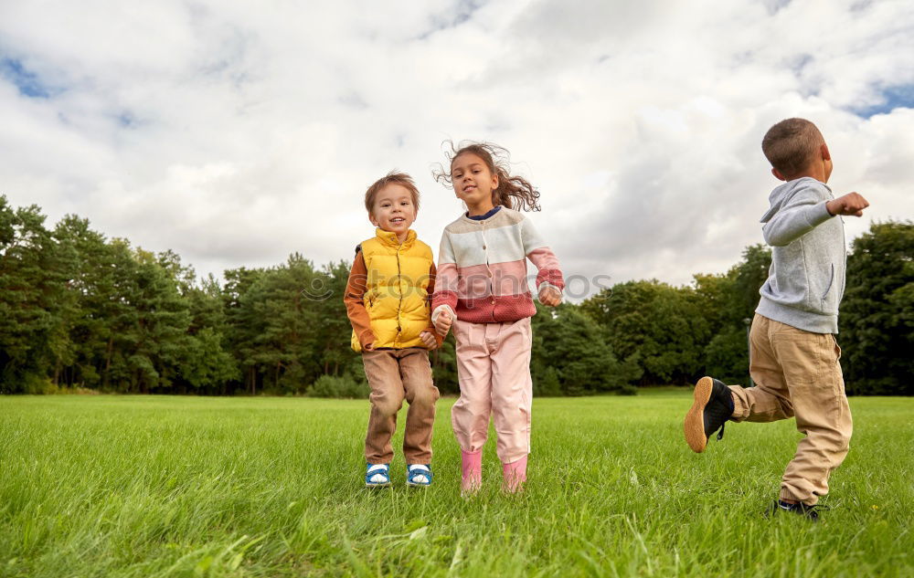 Similar – Image, Stock Photo Three happy children playing in the park at the day time.