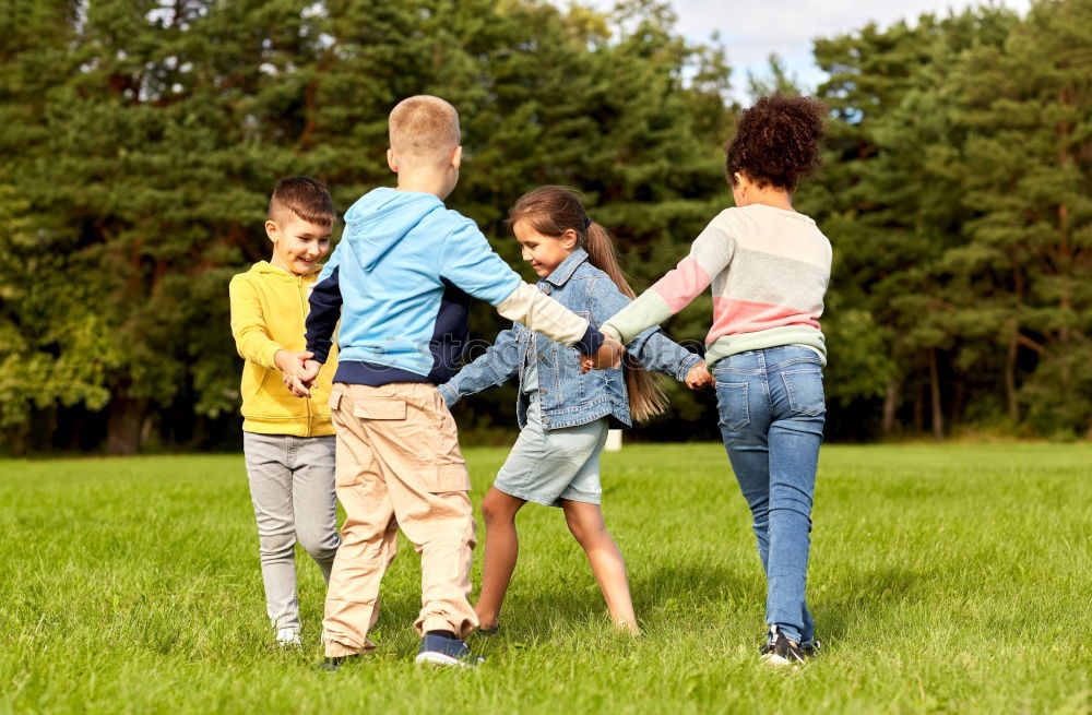 Similar – Children have fun running in nature