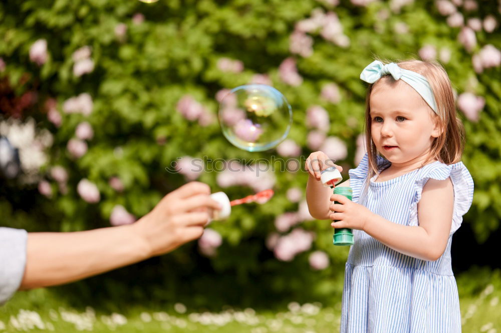 Similar – Image, Stock Photo Father showing grasshopper to children