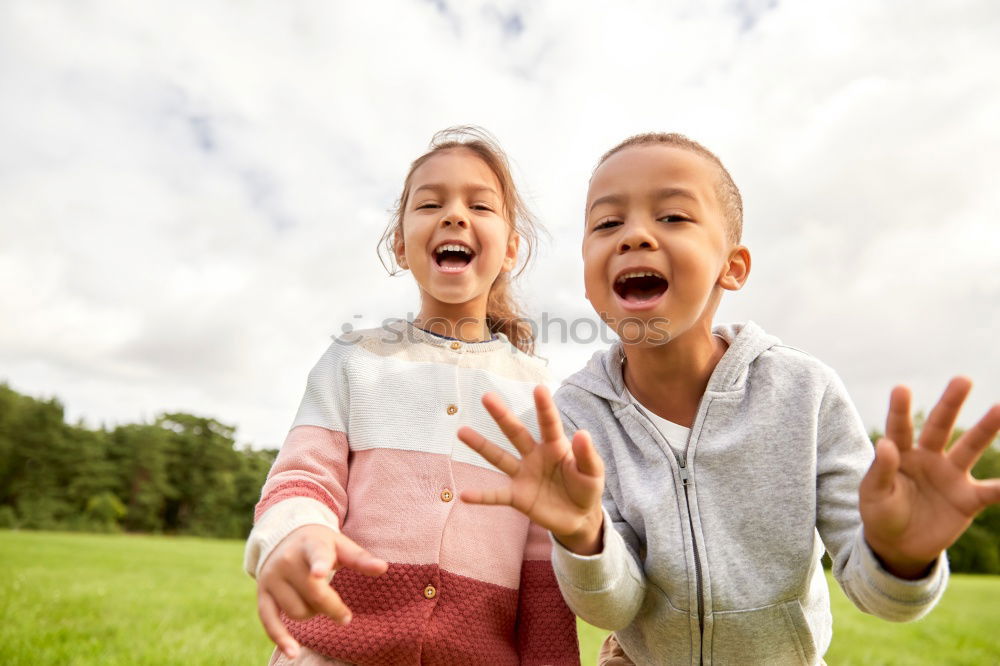 Similar – Image, Stock Photo Sister and brother playing on the beach at the day time. Concept Brother And Sister Together Forever