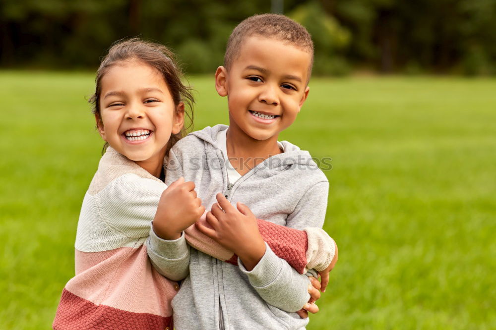 Similar – Image, Stock Photo Two happy children playing near a tree on the grass