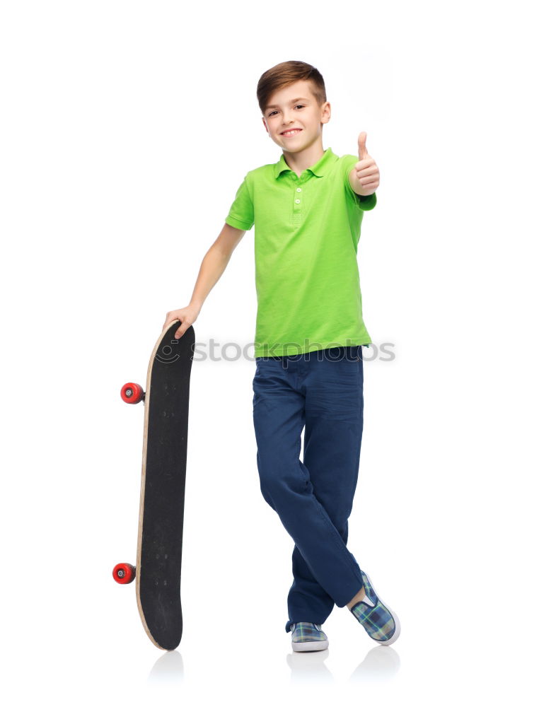 Close-up of a teenage boy carrying skateboard and smiling