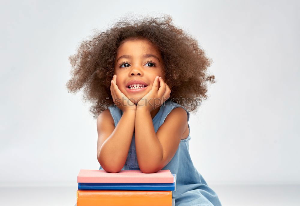 Similar – Young black woman, afro hairstyle, sitting outdoors