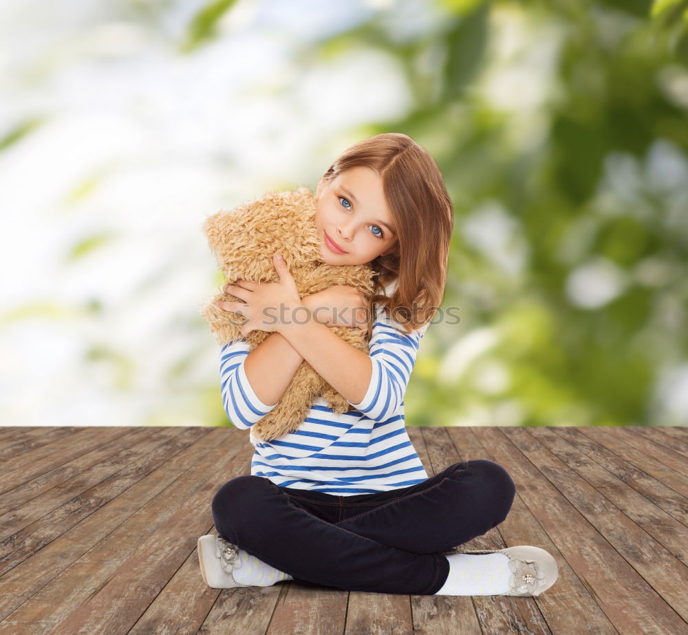 Similar – Young girl cuddles stuffy