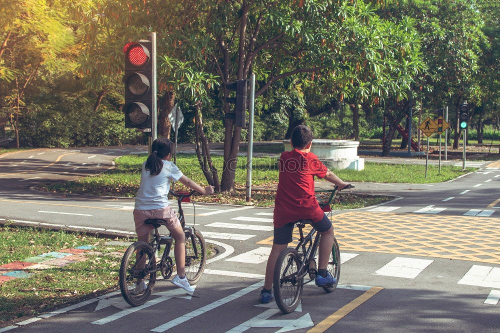 Similar – Image, Stock Photo Family with children riding bicycles in the nature
