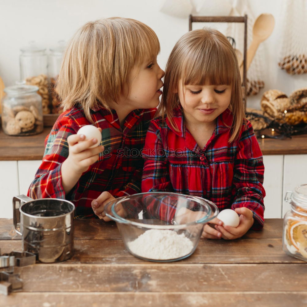 Similar – Little sisters girl preparing baking cookies.