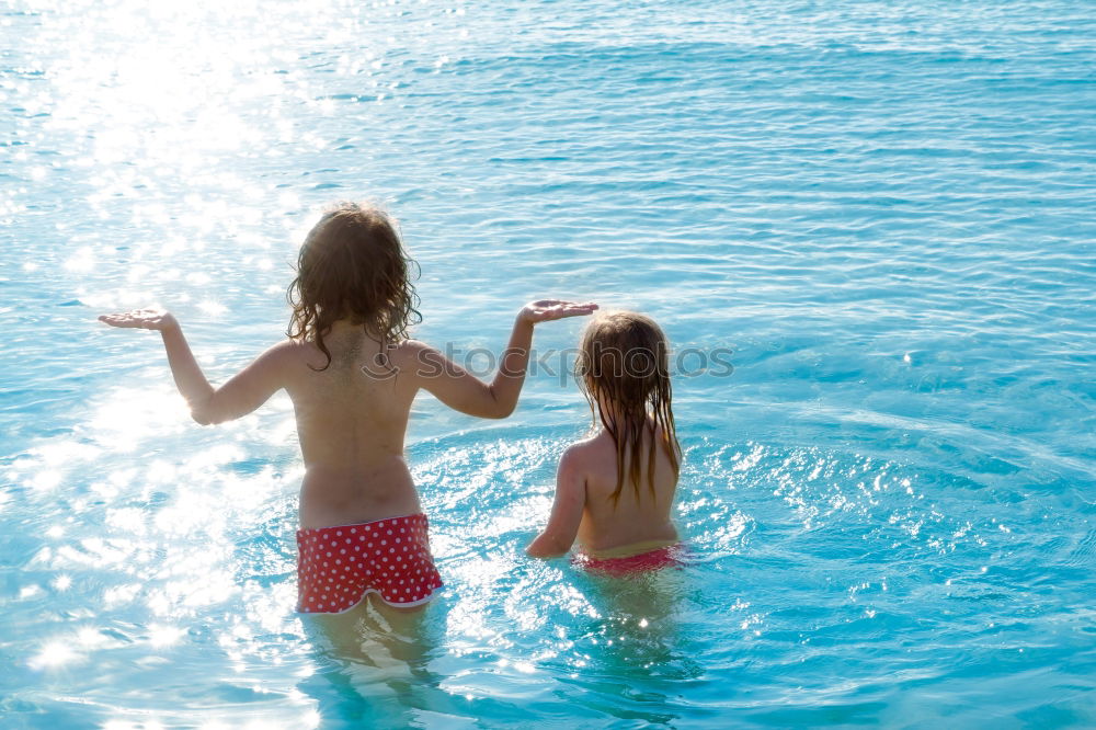 Similar – Image, Stock Photo Mother and son pointing a place near the sea