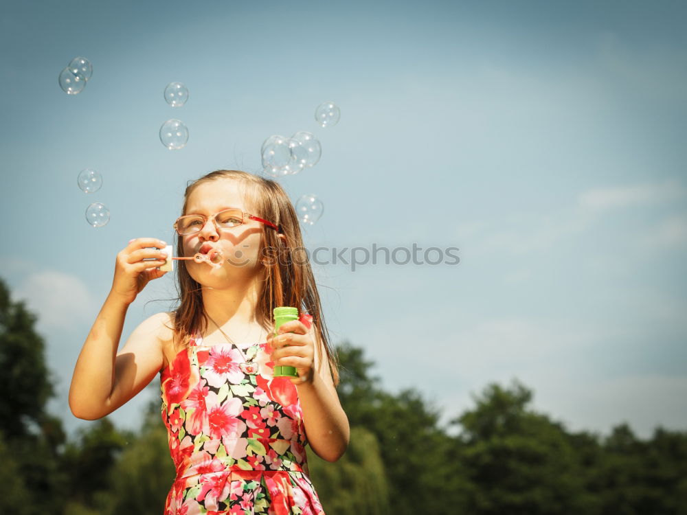 Similar – Image, Stock Photo Girl blowing balloon outside