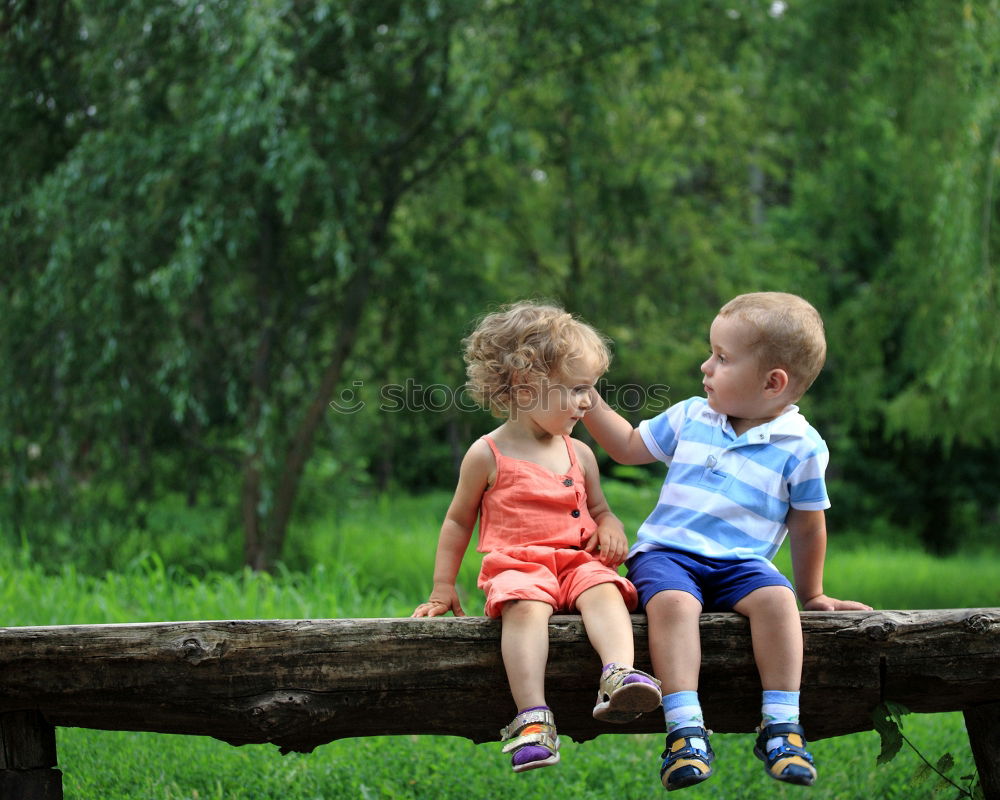 Similar – Image, Stock Photo Young boy pushing little sister in a baby stroller