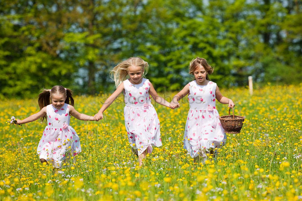 Similar – Three happy children playing in the park at the day time.