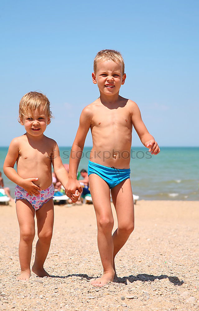 Similar – Two happy children playing on the beach