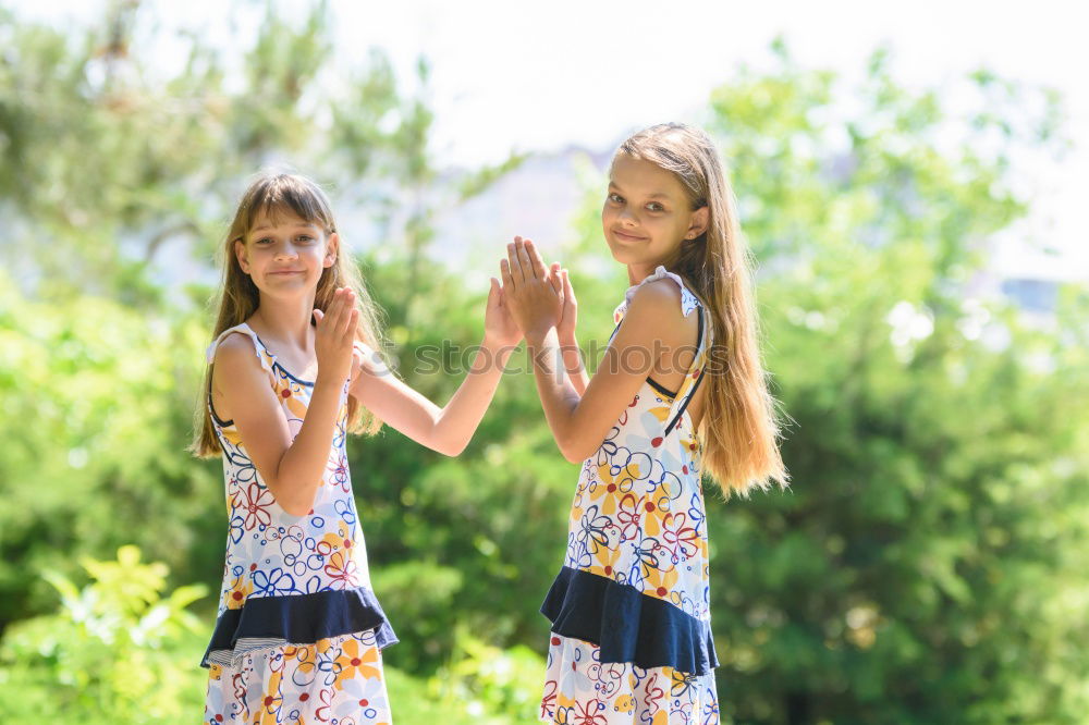 Similar – Two happy girls hugging in urban park.