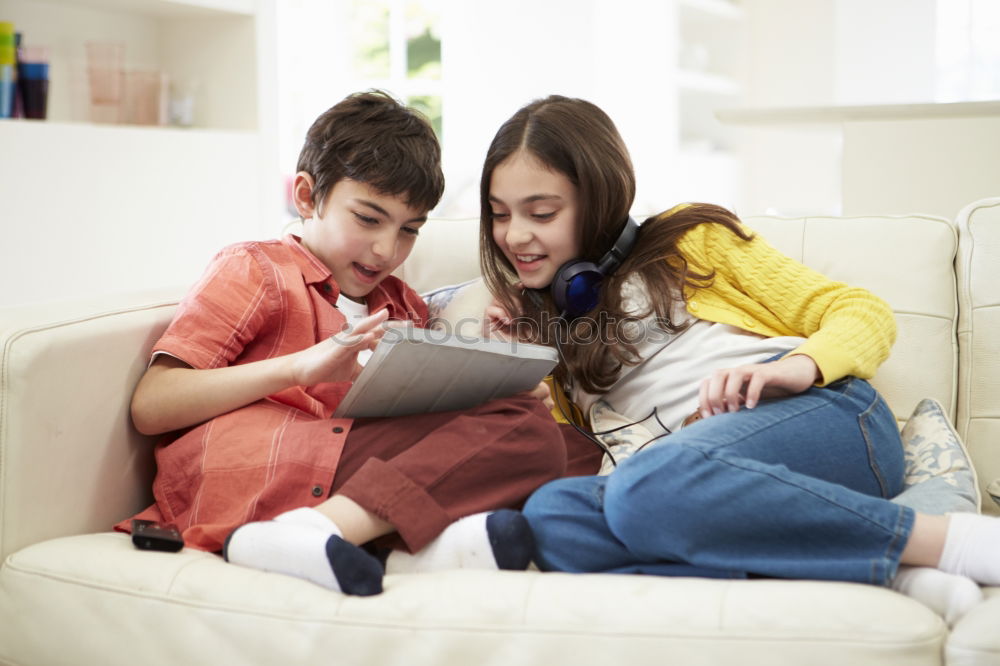 Similar – happy mother and toddler son using tablet