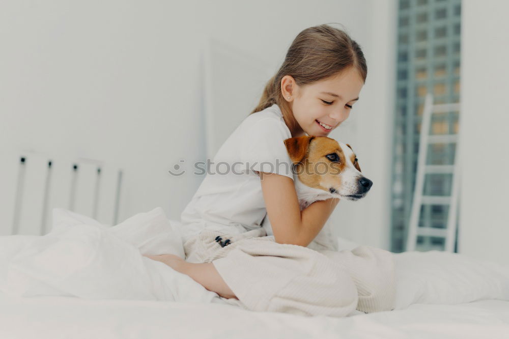 Similar – Image, Stock Photo young woman and her cute dog on bed