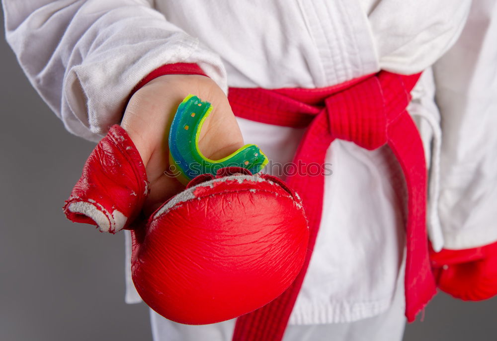 Similar – Image, Stock Photo red leather boxing gloves, a plastic water bottle