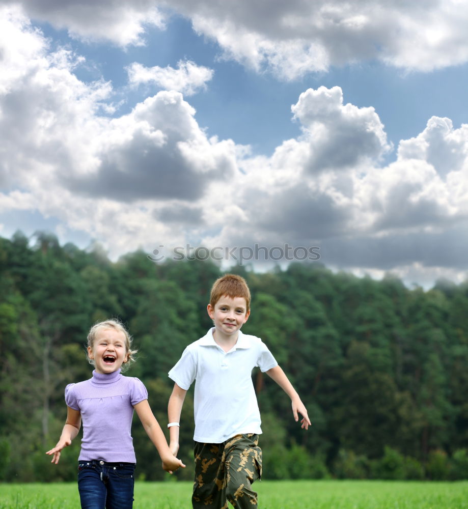 Similar – Father and son playing on the road at the day time.