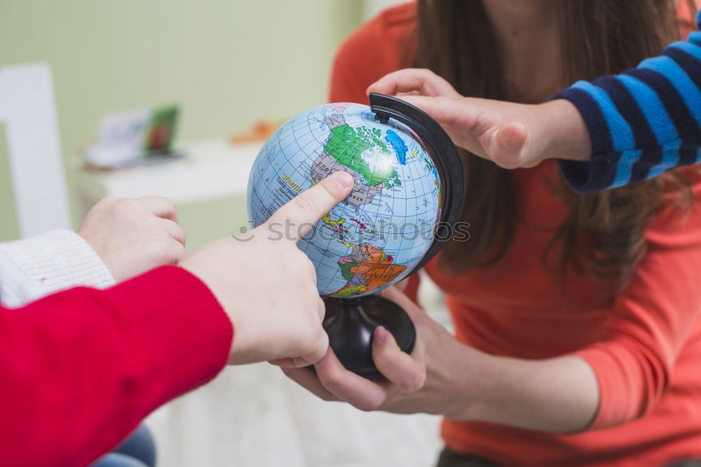 Similar – Image, Stock Photo Teenagers sitting by the map in classroom