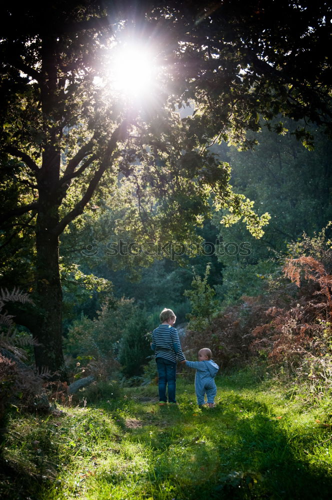 Similar – Image, Stock Photo Mother with her little daughter walking through the forest