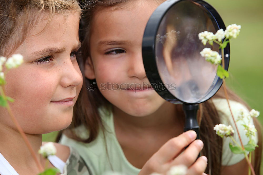 Similar – Image, Stock Photo Happy little girl exploring nature with magnifying glass
