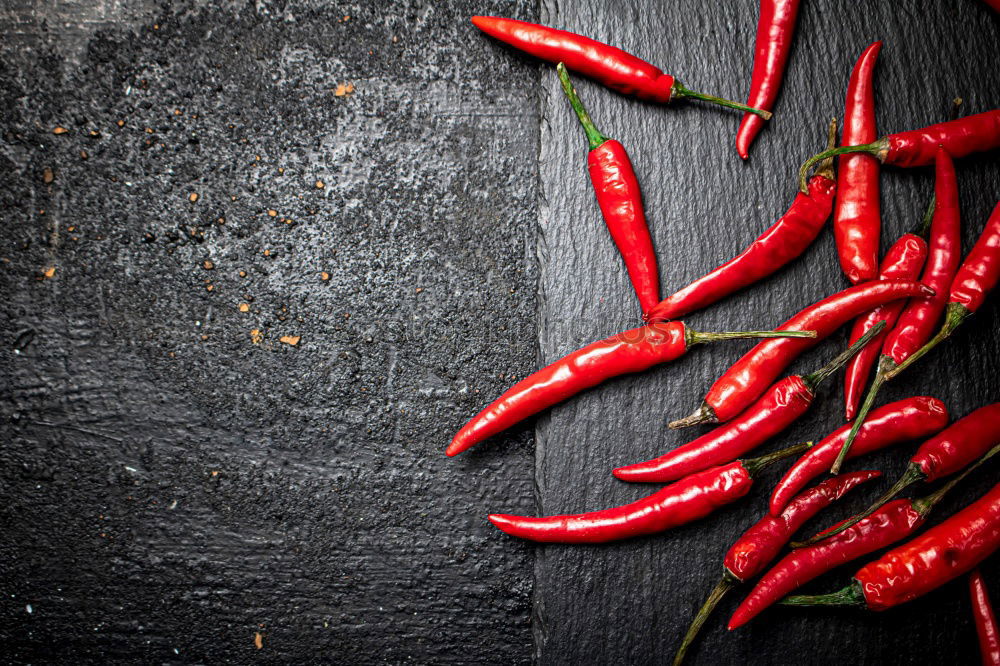 Similar – Image, Stock Photo Red hot chili peppers on a wooden background