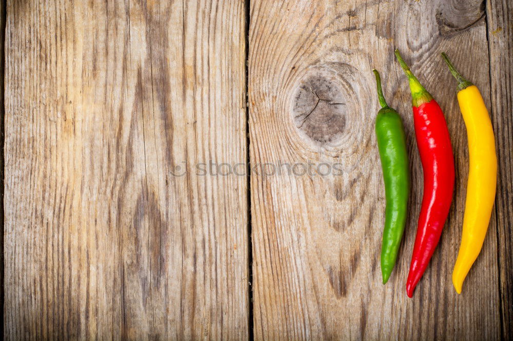 Similar – Frische Peperoni auf dem Zweig mit Blättern