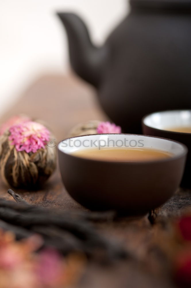 Similar – Black tea in a white cup and saucer and jasmine flowers