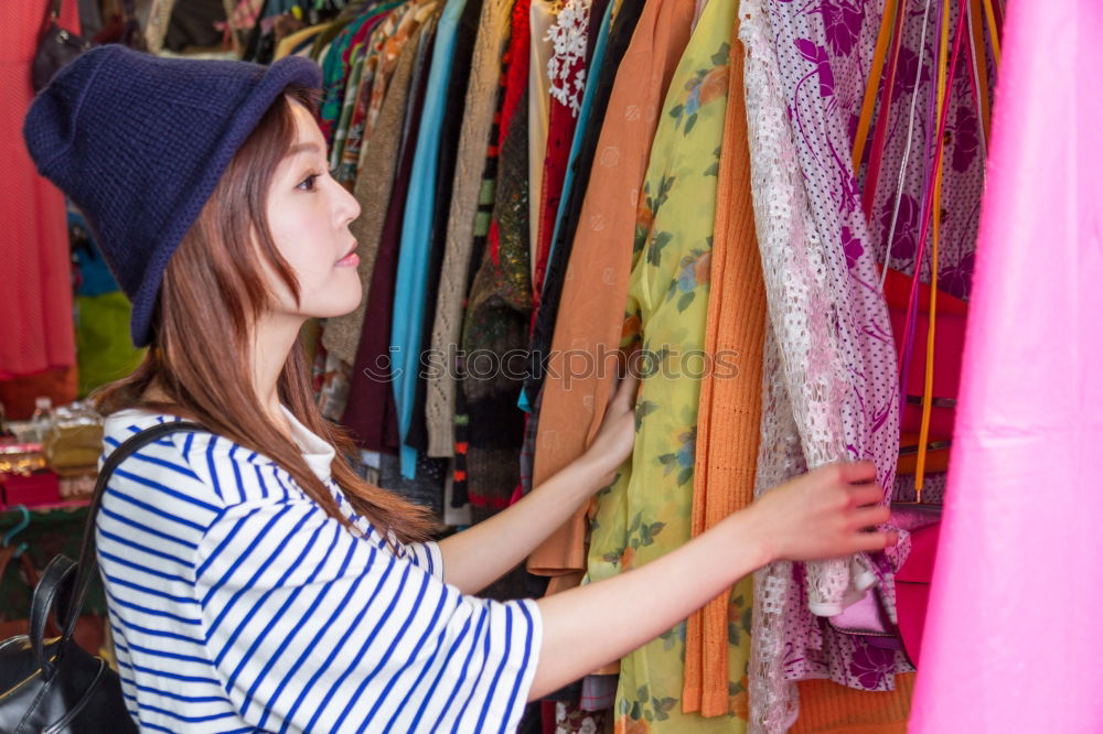 Similar – Woman smelling flower on market