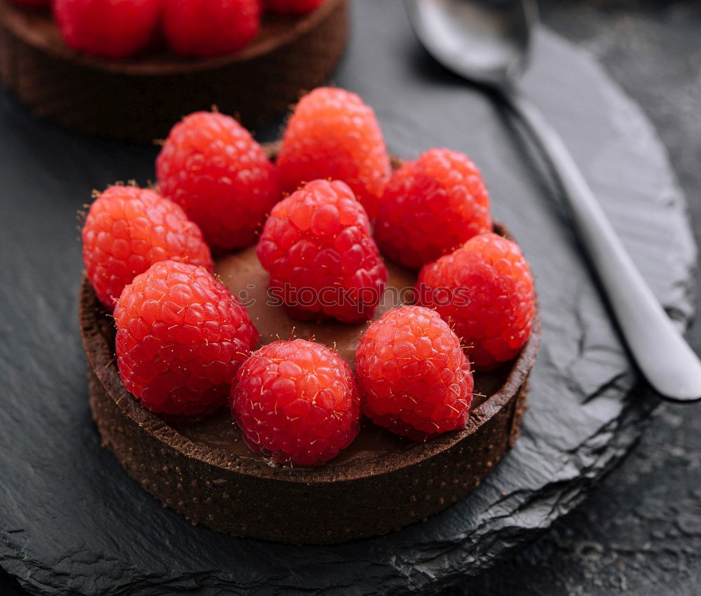 Similar – Image, Stock Photo Chocolate Tiramisu cake with strawberries on black slate