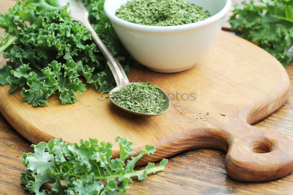 Similar – Green kale pesto in glass on dark rustic kitchen table background with ingredients, top view. Kale preparation. Healthy detox vegetables . Clean eating and dieting concept.